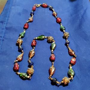 Glass beaded 56" long blue and clear necklace